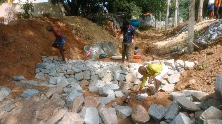 Building boulder checks, slowing the rush of water to help it soak deep into the earth